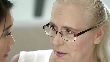 Asian teen tutoring an old woman