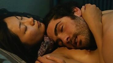 Asian girl is making love to a dominant American man in this amazing scene